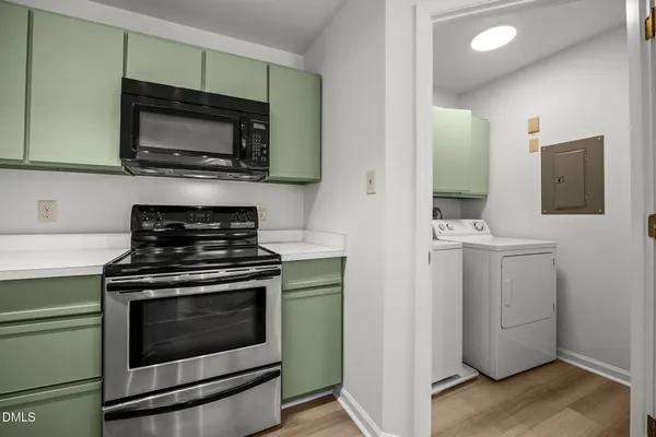 a kitchen with a stove and a microwave