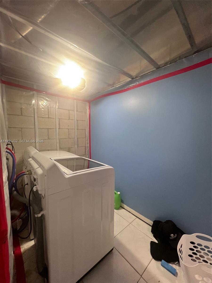 4681 Cherry Road West Palm Beach, FL 33417 - Photo 14 of 33 a view of storage and utility room with a washer and dryer