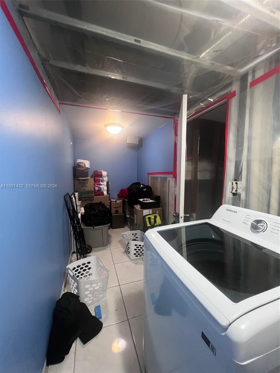 4681 Cherry Road West Palm Beach, FL 33417 - Photo 15 of 33 a kitchen with a sink and a toilet