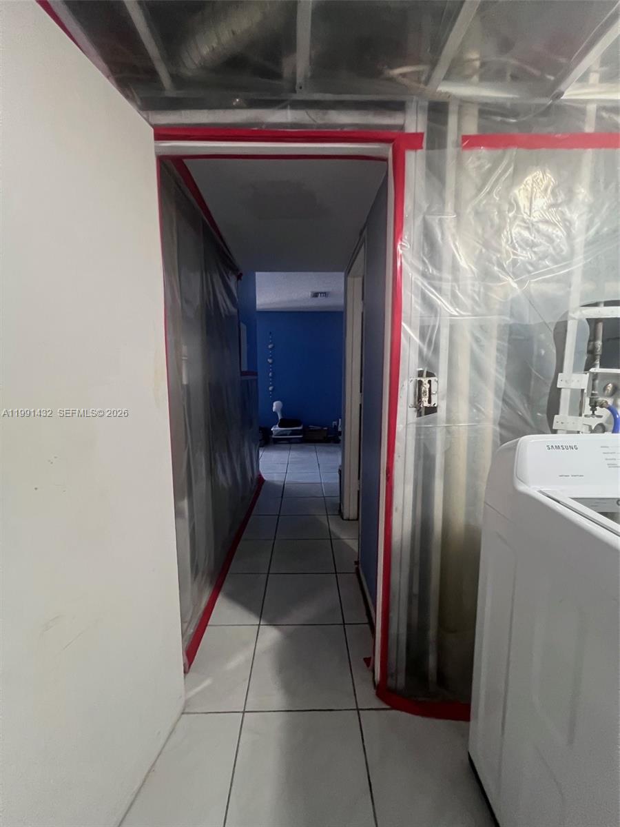 4681 Cherry Road West Palm Beach, FL 33417 - Photo 16 of 33 a hallway with cabinets and a fireplace