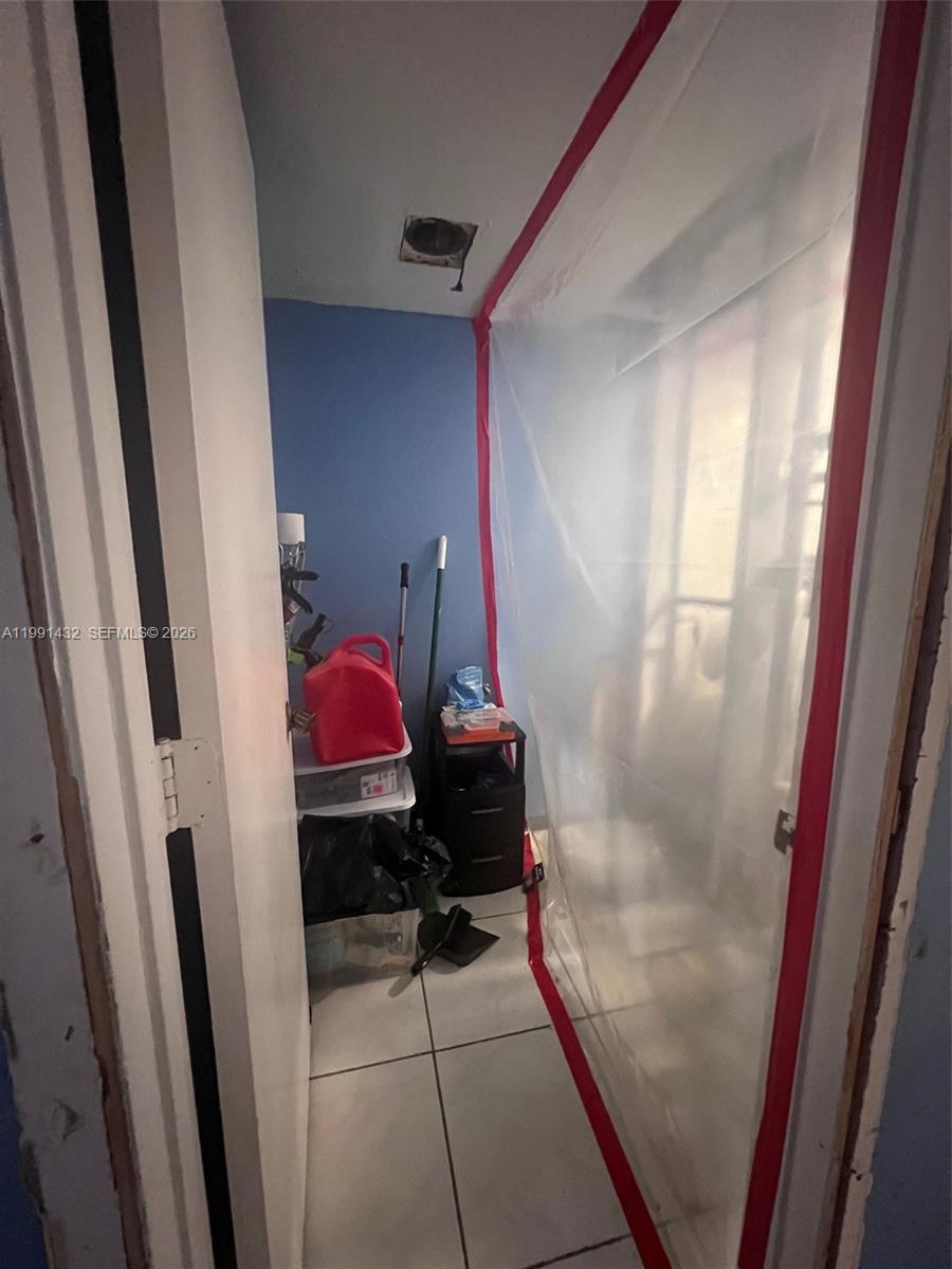 4681 Cherry Road West Palm Beach, FL 33417 - Photo 17 of 33 a room that has a bed in it