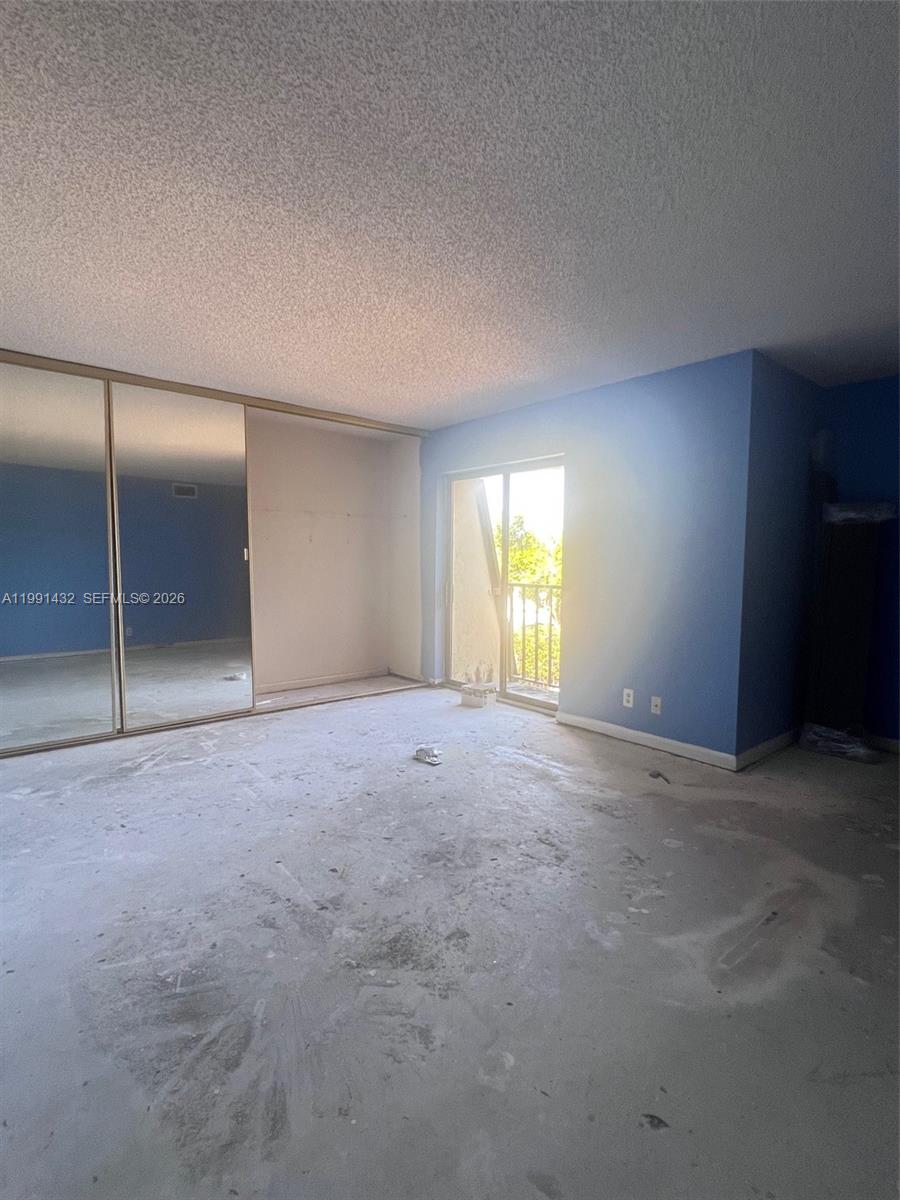 4681 Cherry Road West Palm Beach, FL 33417 - Photo 20 of 33 a view of an empty room with a window