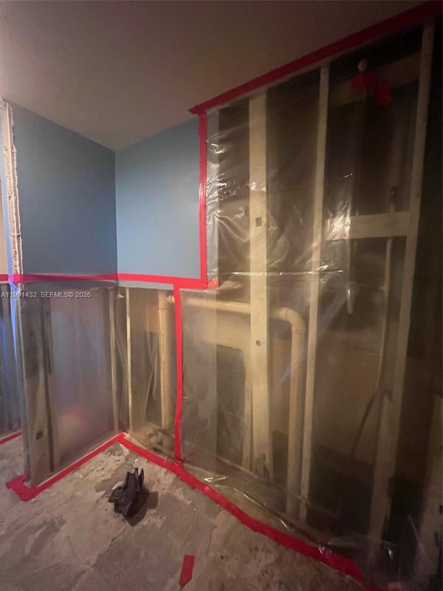 4681 Cherry Road West Palm Beach, FL 33417 - Photo 23 of 33 a view of a room with storage space and a wooden floor