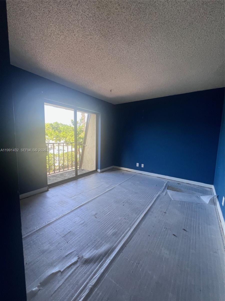 4681 Cherry Road West Palm Beach, FL 33417 - Photo 26 of 33 an empty room with windows