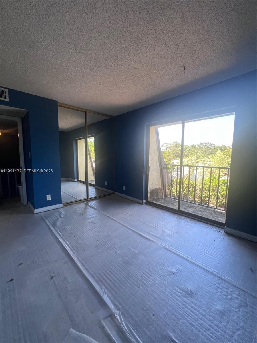 4681 Cherry Road West Palm Beach, FL 33417 - Photo 27 of 33 an empty room with windows and view