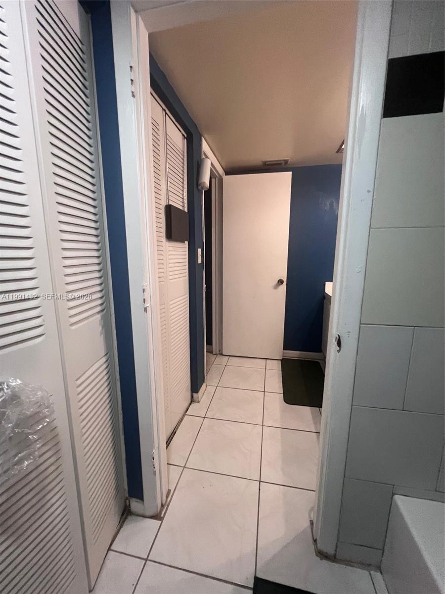 4681 Cherry Road West Palm Beach, FL 33417 - Photo 32 of 33 a view of bathroom with a sink and a mirror