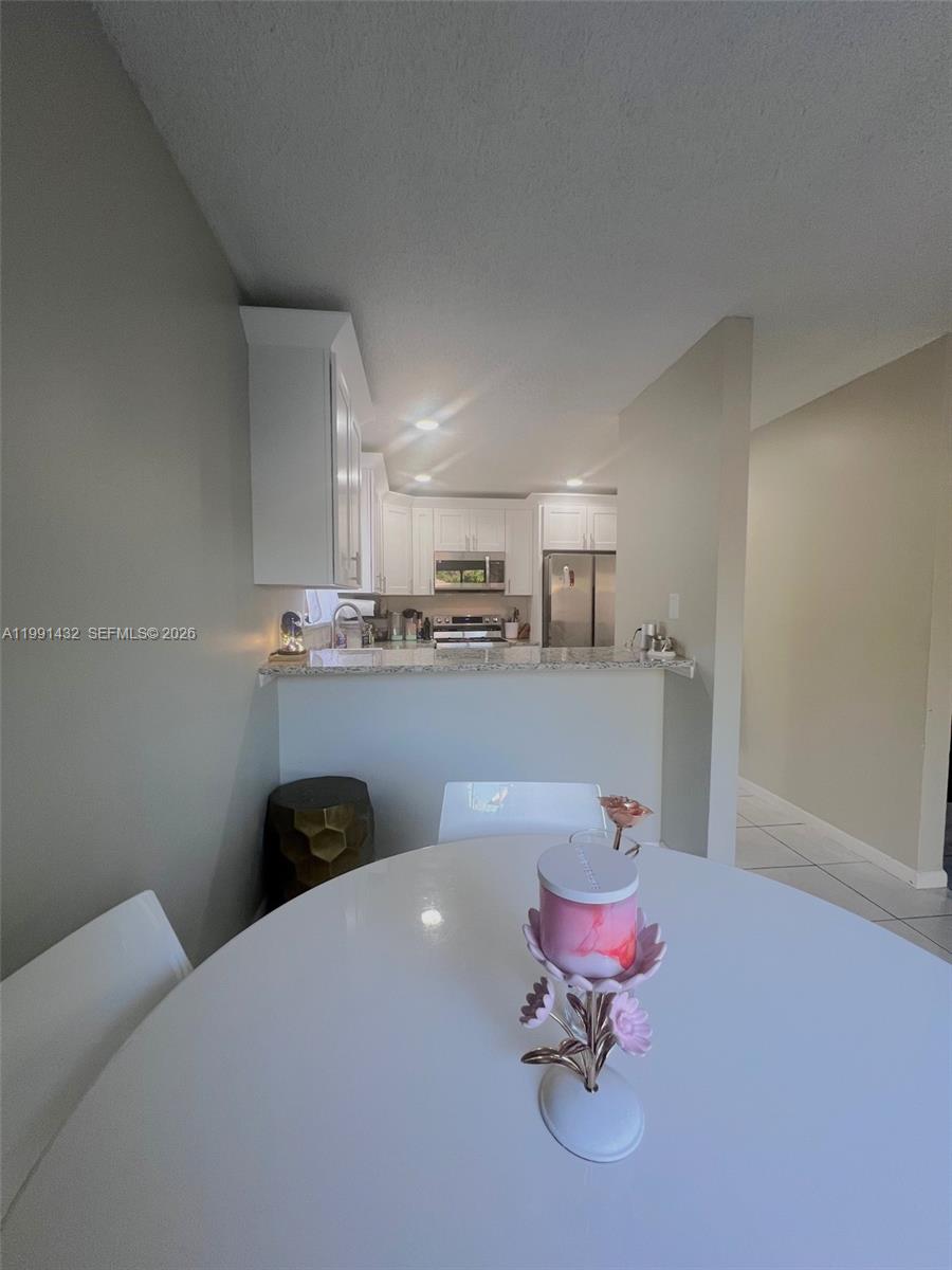 4681 Cherry Road West Palm Beach, FL 33417 - Photo 6 of 33 a living room with furniture and kitchen view