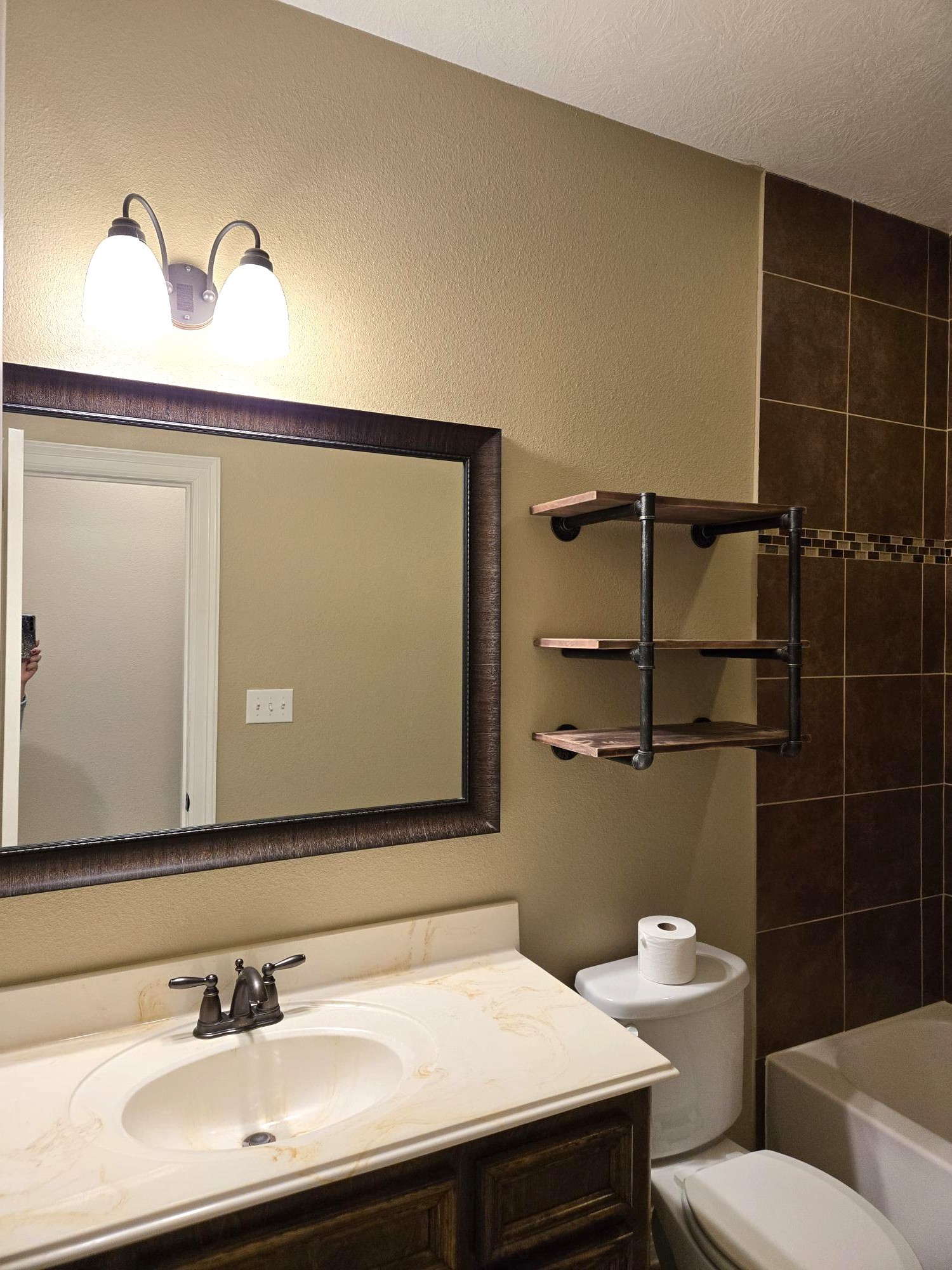 306 Masterson Street Arcola, TX 77583 - Photo 21 of 28 a bathroom with a sink a toilet and a mirror