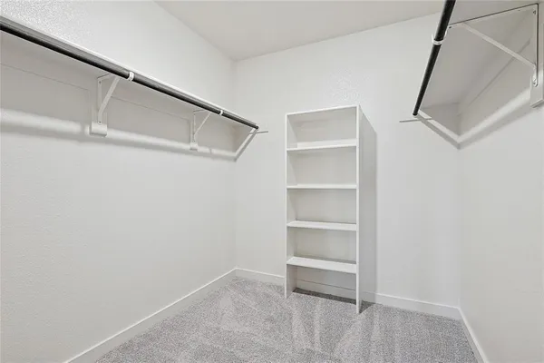 a bathroom with a double vanity sink mirror and shower