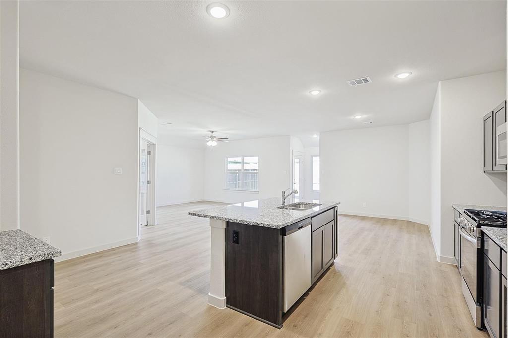 1759 Gleasondale Place Forney, TX 75126 - Photo 25 of 25 a kitchen with a sink and cabinets