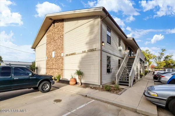a view of a car park in front of house