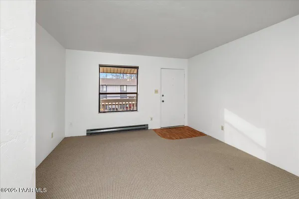 a view of room with a ceiling fan