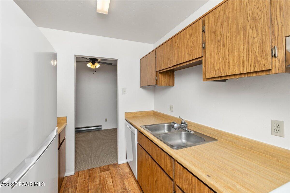 849 Sunset Avenue Prescott, AZ 86305 - Photo 26 of 30 a kitchen with a sink a stove and cabinets