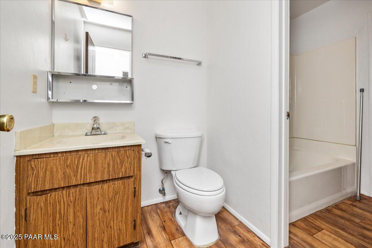 849 Sunset Avenue Prescott, AZ 86305 - Photo 28 of 30 a bathroom with a toilet sink and mirror