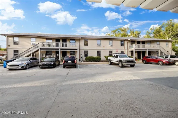 a view of street with parked cars