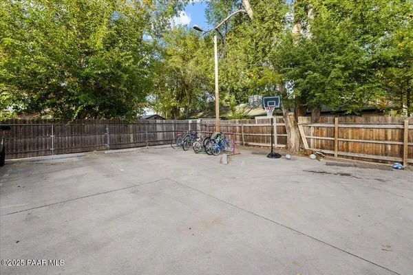 a view of outdoor space with iron fence