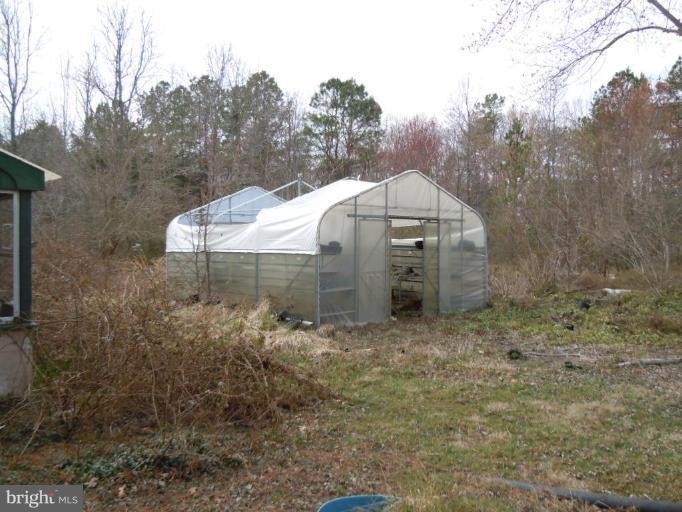 8721 Cummings Road Wittman, MD 21676 - Photo 3 of 4 a view of a tiny house with a yard