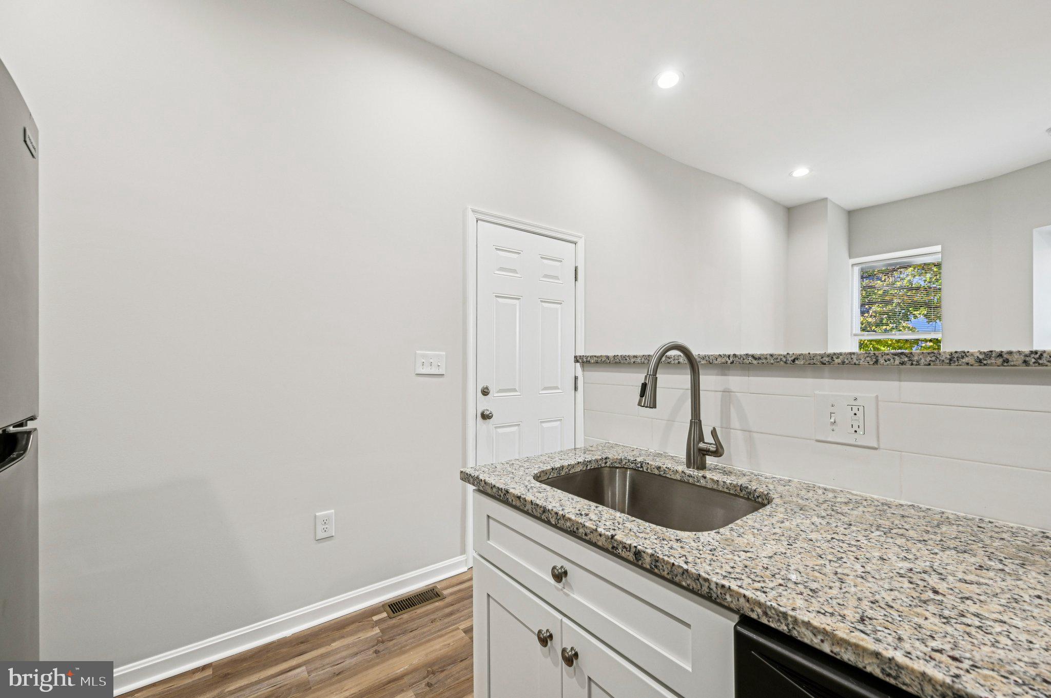 750 Reservoir Street, Unit A Baltimore, MD 21217 - Photo 14 of 23 a kitchen with a sink and cabinets