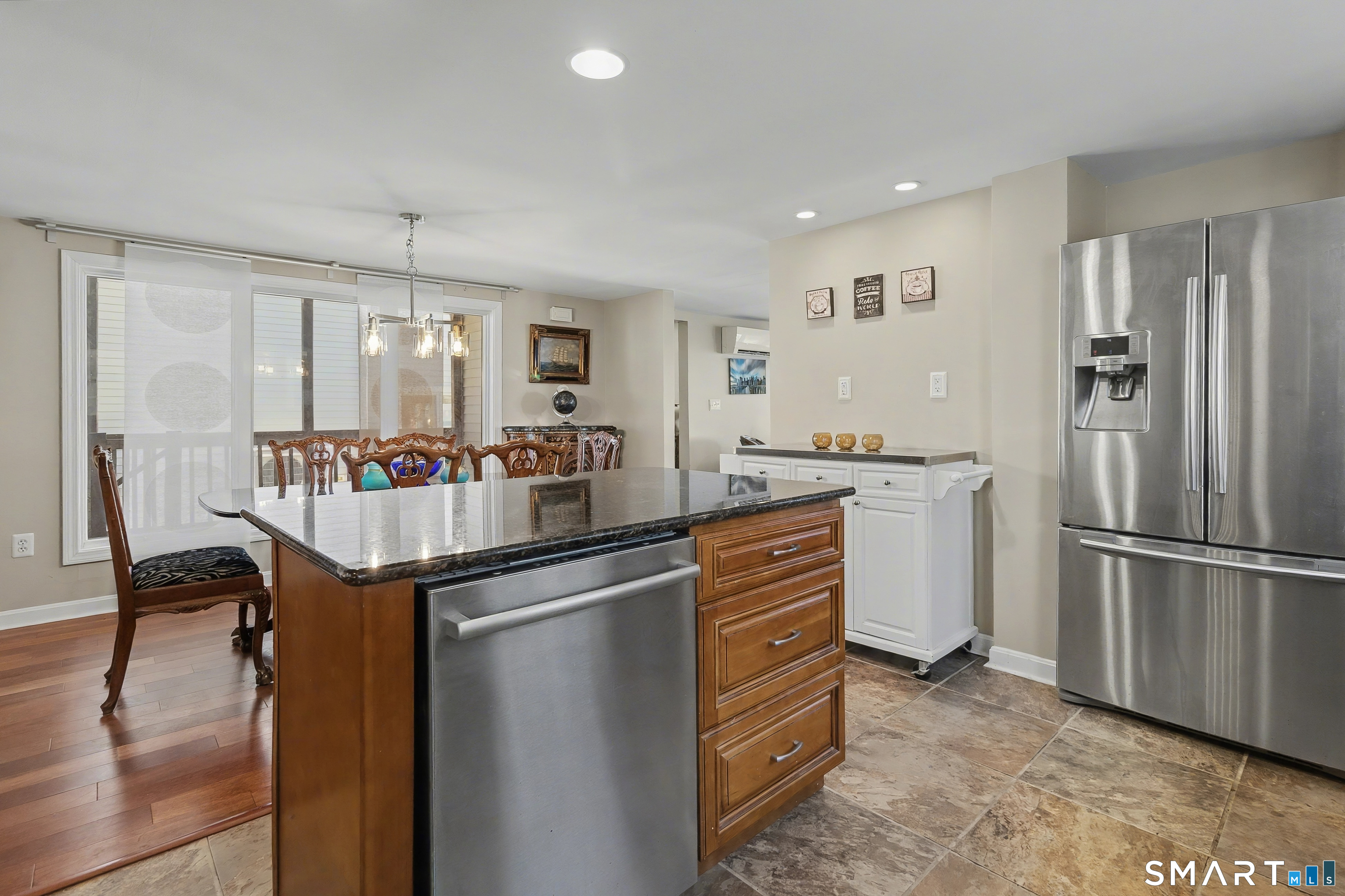 51 Point Beach Drive Milford, CT 06460 - Photo 12 of 32 a kitchen with kitchen island a sink stainless steel appliances and cabinets