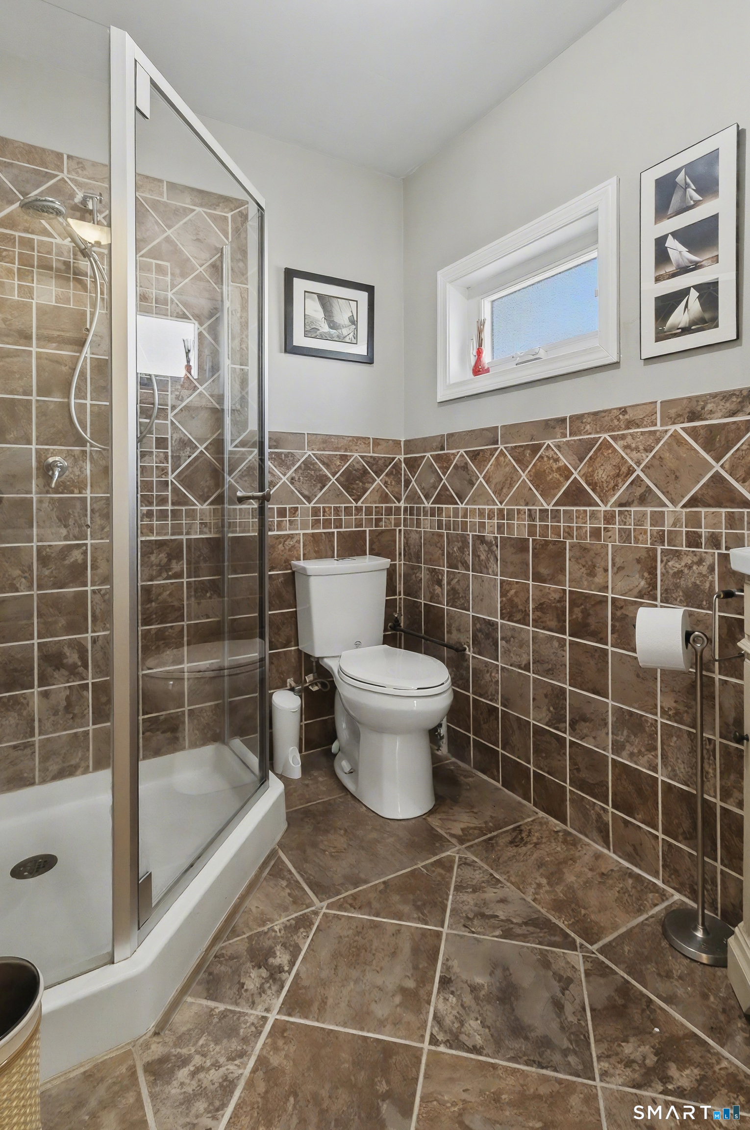 51 Point Beach Drive Milford, CT 06460 - Photo 15 of 32 a bathroom with a toilet and a shower