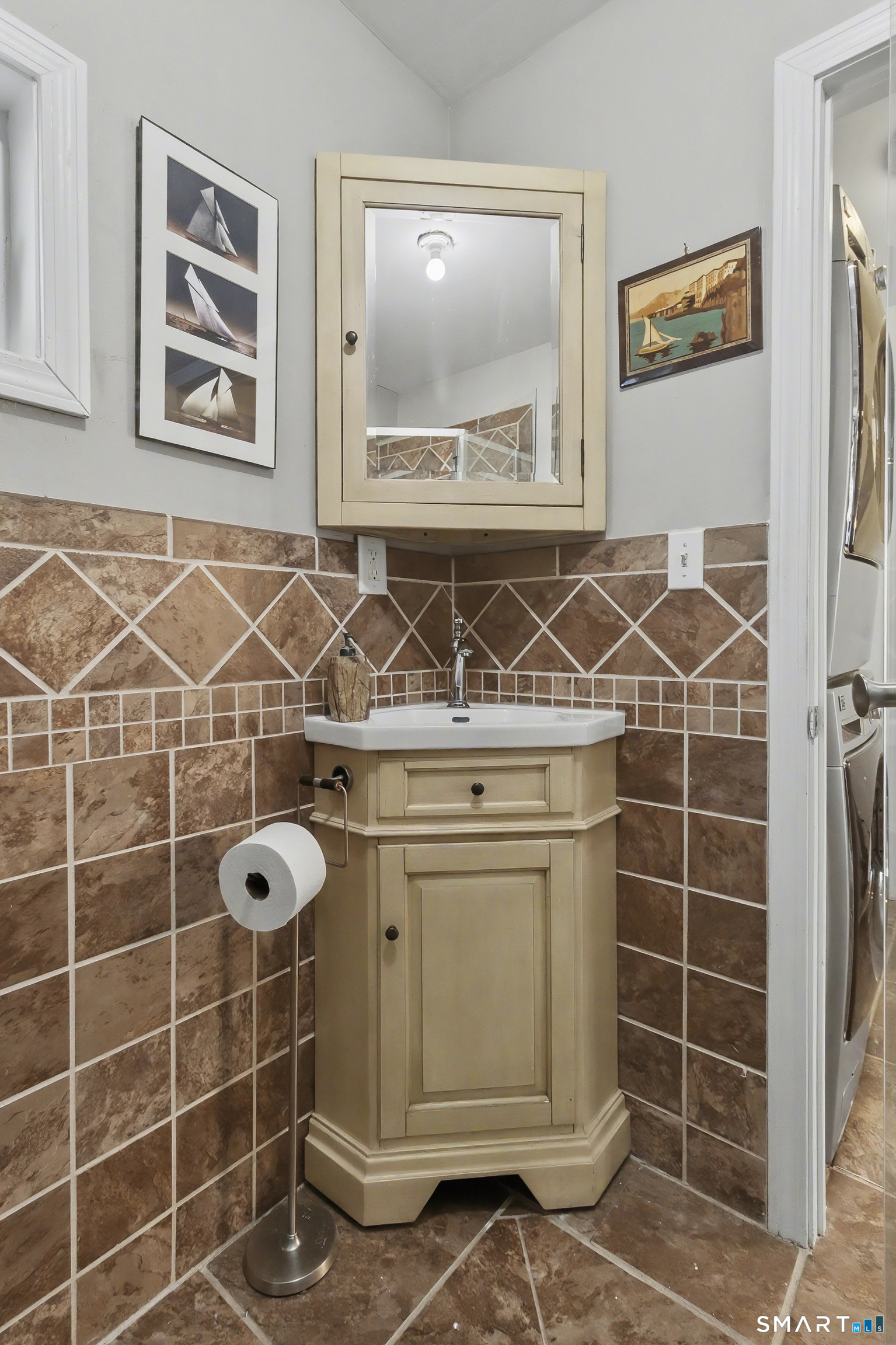 51 Point Beach Drive Milford, CT 06460 - Photo 16 of 32 a bathroom with a shower and a sink