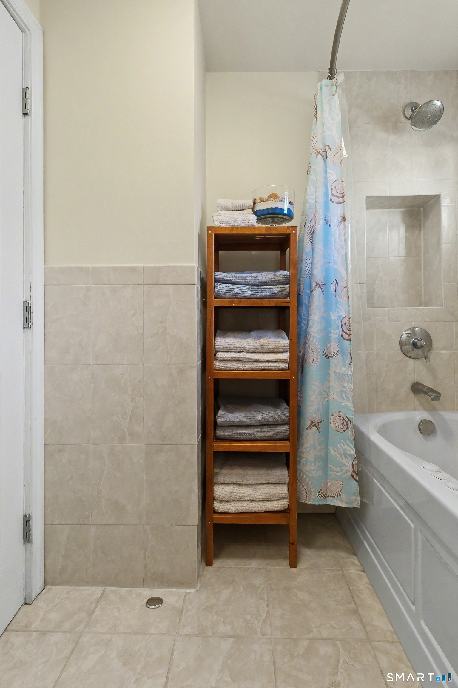 51 Point Beach Drive Milford, CT 06460 - Photo 21 of 32 a bathroom with a sink and a bathtub