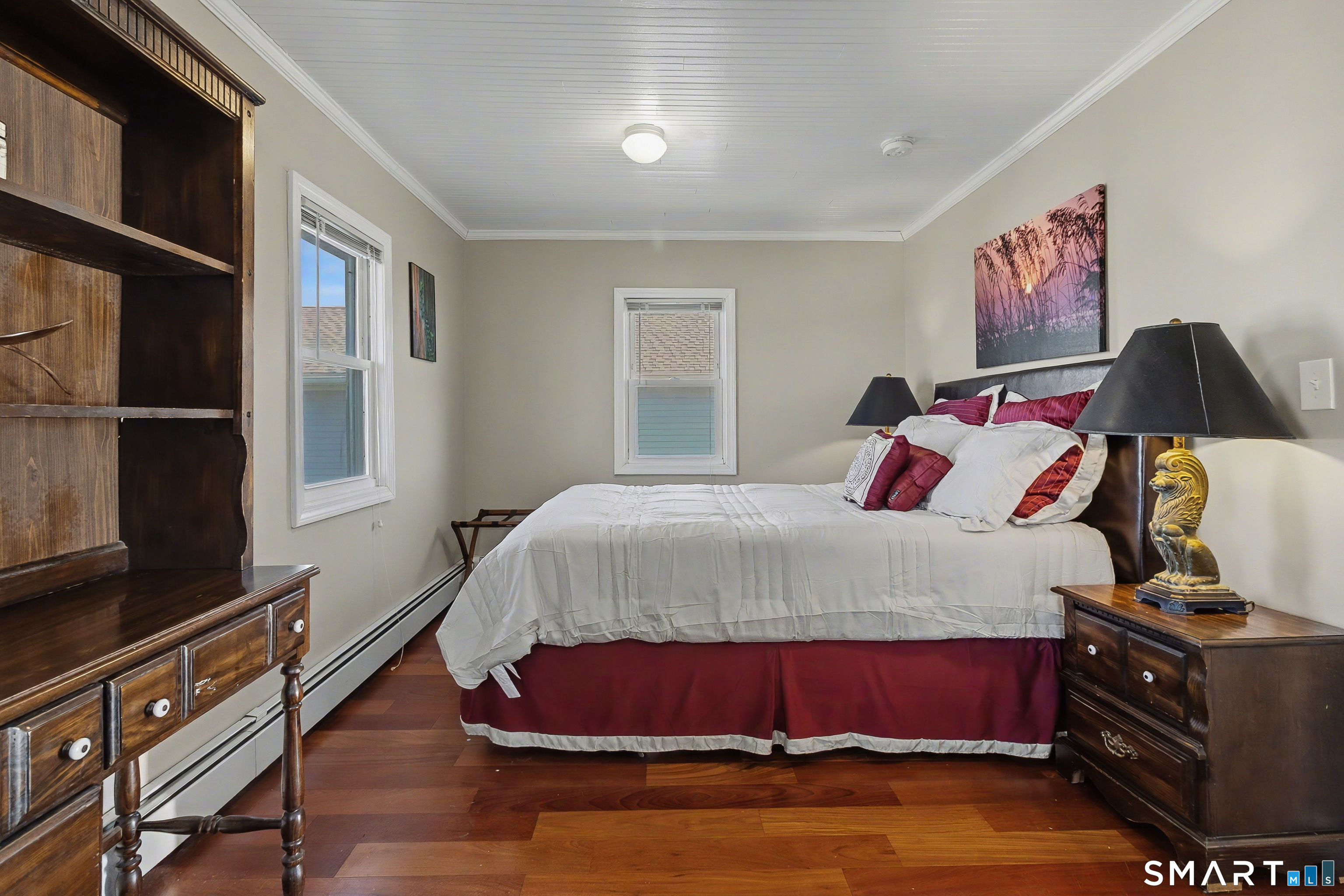 51 Point Beach Drive Milford, CT 06460 - Photo 26 of 32 a bedroom with a bed and wooden floor