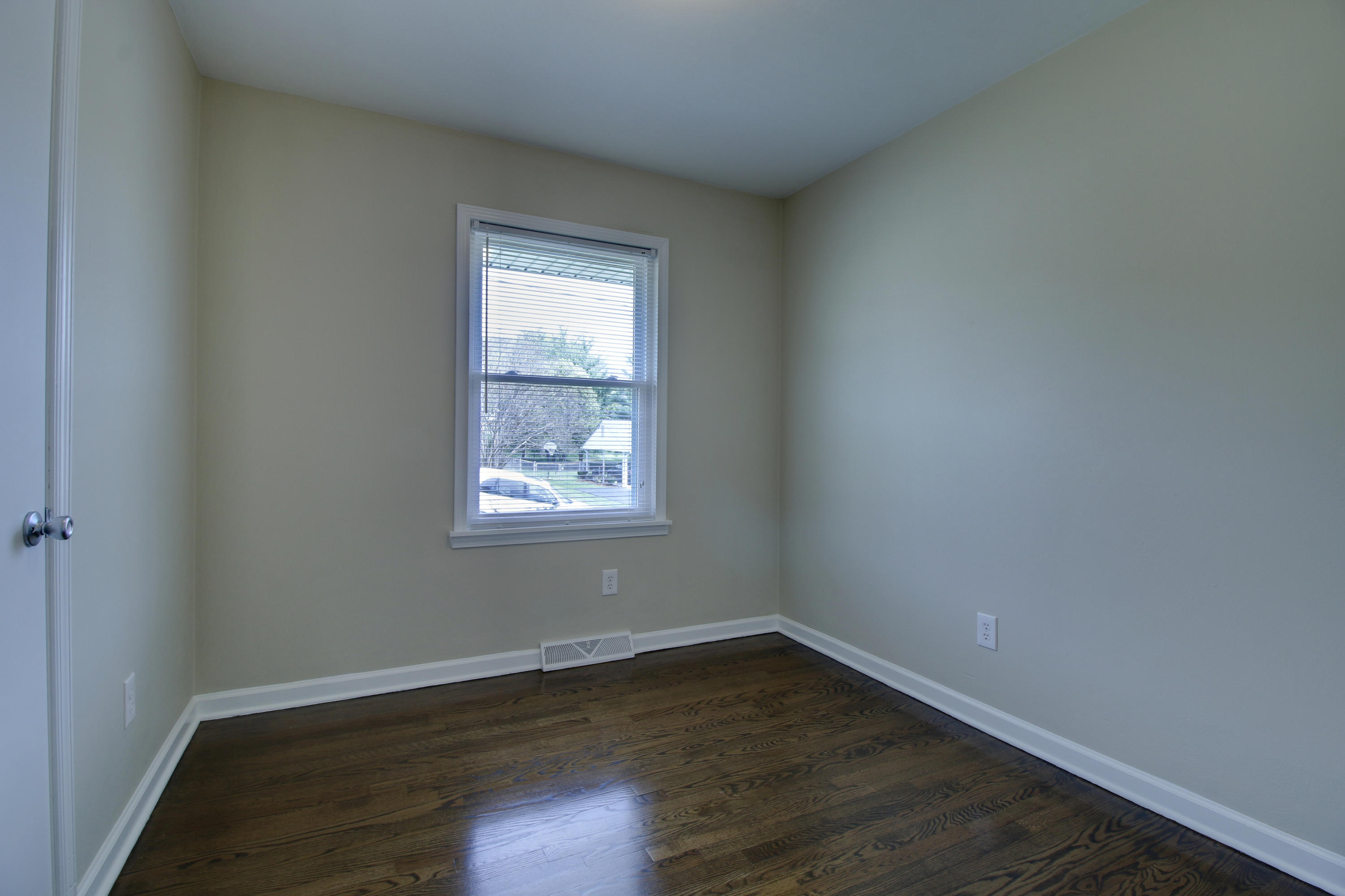 540 Olney Road Vinton, VA 24179 - Photo 14 of 29 an empty room with wooden floor and windows