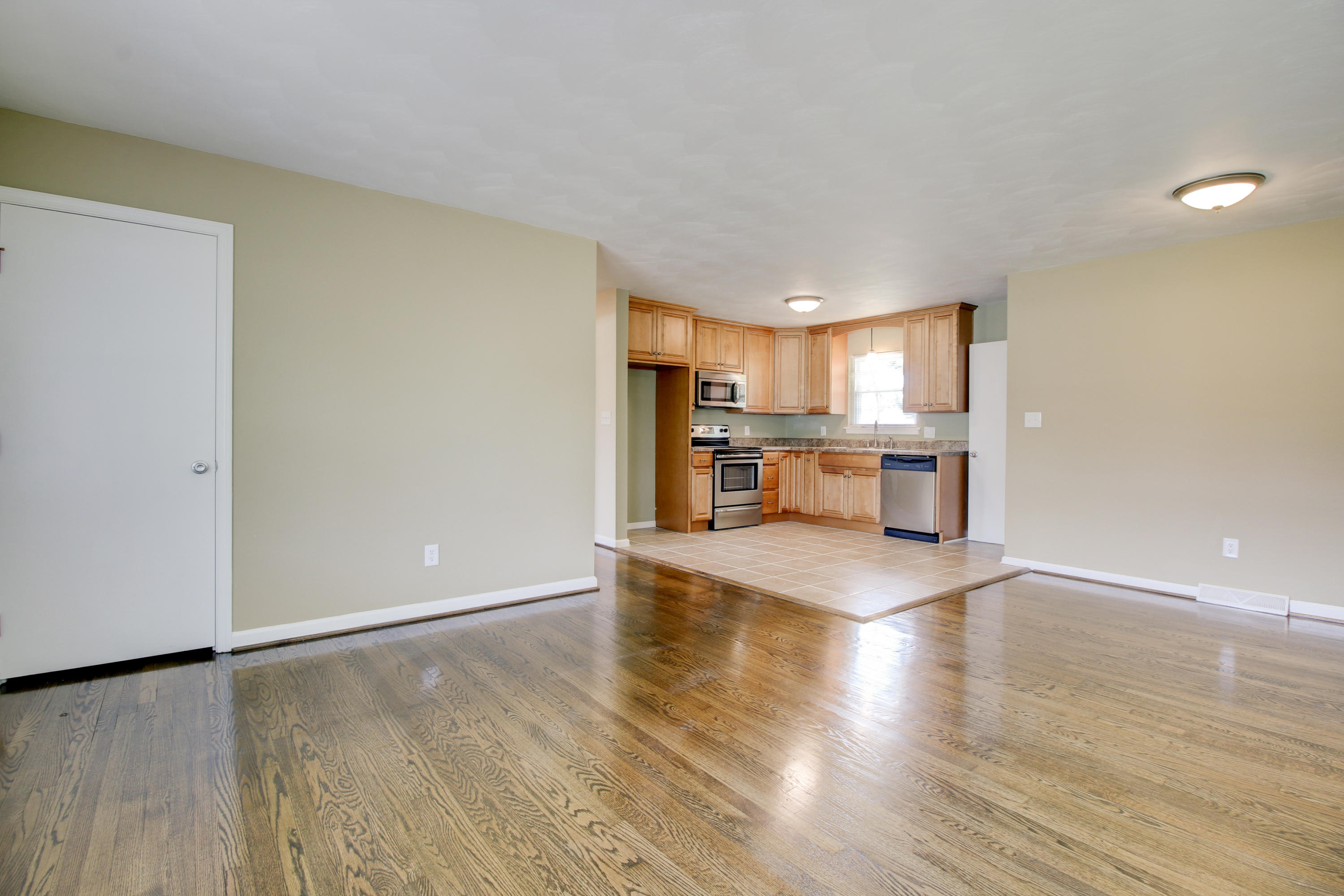 540 Olney Road Vinton, VA 24179 - Photo 3 of 29 a view of a kitchen and an empty room with a window