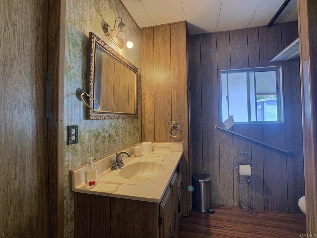 400 Greenfield Drive, Unit 150 El Cajon, CA 92021 - Photo 11 of 21 a bathroom with a sink and a mirror