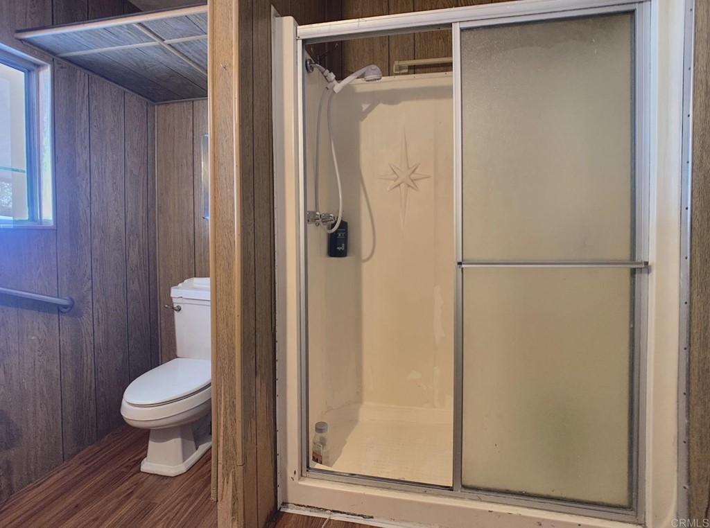 400 Greenfield Drive, Unit 150 El Cajon, CA 92021 - Photo 12 of 21 a bathroom with a toilet and a shower