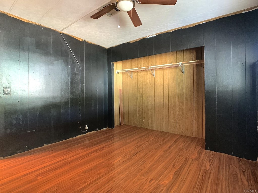 400 Greenfield Drive, Unit 150 El Cajon, CA 92021 - Photo 16 of 21 wooden floor in an empty room with a bathroom