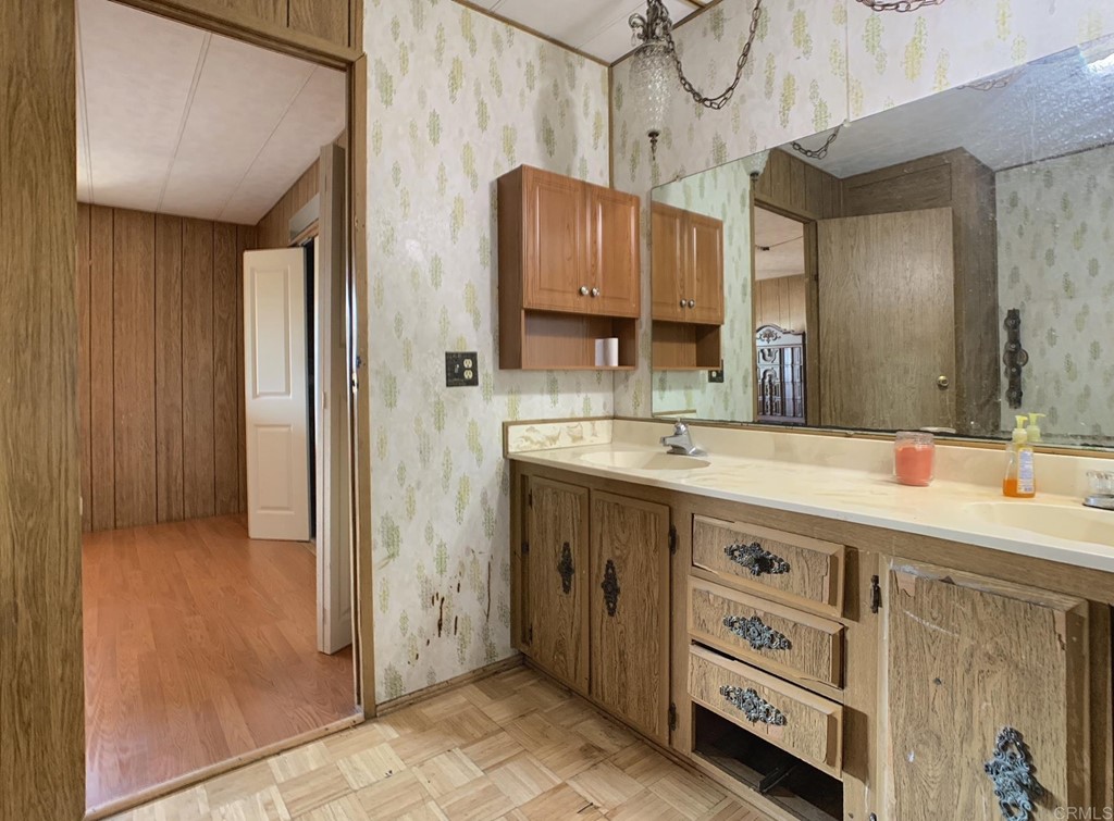 400 Greenfield Drive, Unit 150 El Cajon, CA 92021 - Photo 17 of 21 a bathroom with a sink double vanity and a mirror