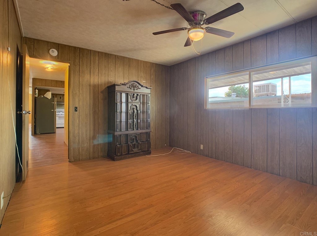 400 Greenfield Drive, Unit 150 El Cajon, CA 92021 - Photo 18 of 21 an empty room with fan and windows