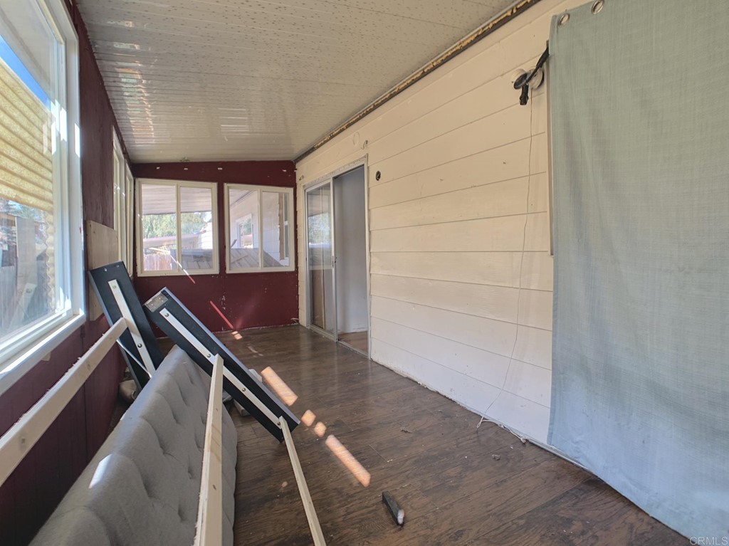 400 Greenfield Drive, Unit 150 El Cajon, CA 92021 - Photo 20 of 21 a view of kitchen with wooden floor and chair