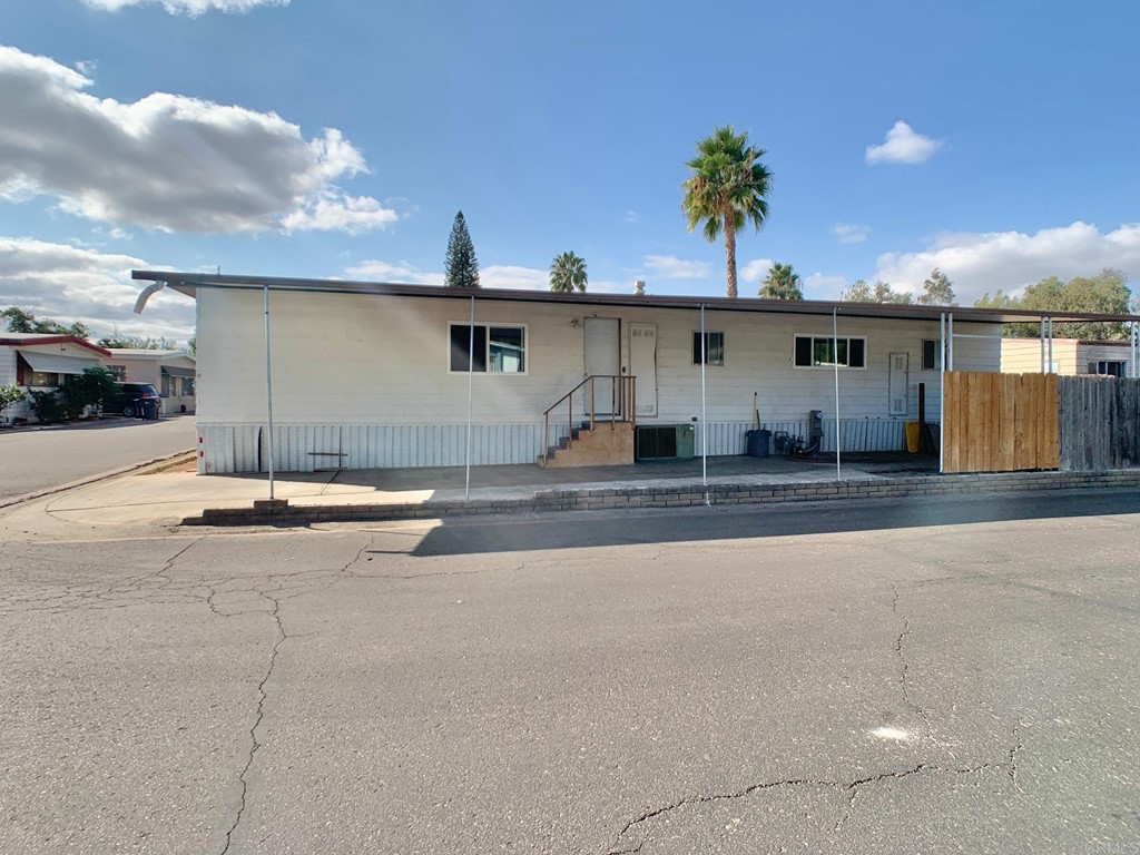 400 Greenfield Drive, Unit 150 El Cajon, CA 92021 - Photo 4 of 21 a view of a house with a street