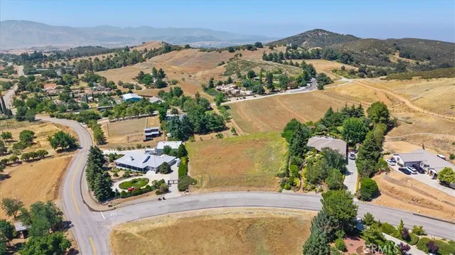 an aerial view of residential house with outdoor space and river view