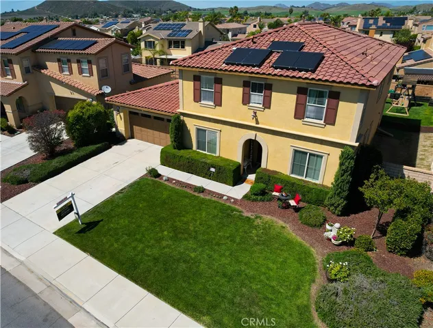 a aerial view of a house with swimming pool