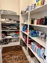 a view of a backyard with plants and a fire pit