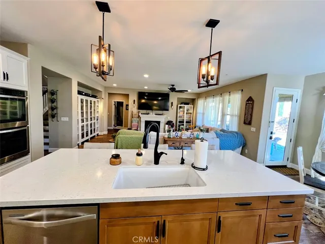 a bedroom with a bed and a mirror on the wall