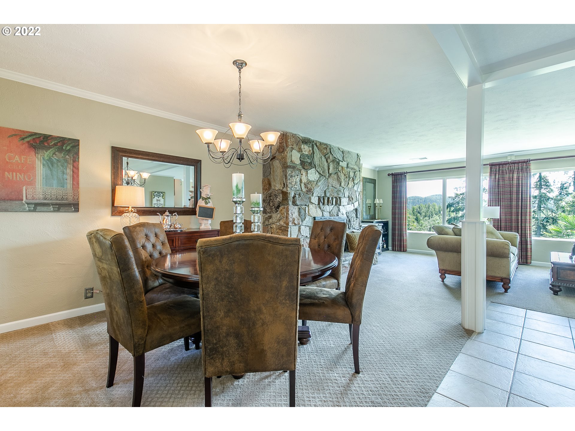 33315 Bloomberg Road Eugene, OR 97405 - Photo 11 of 32 a dining room with furniture a chandelier and wooden floor