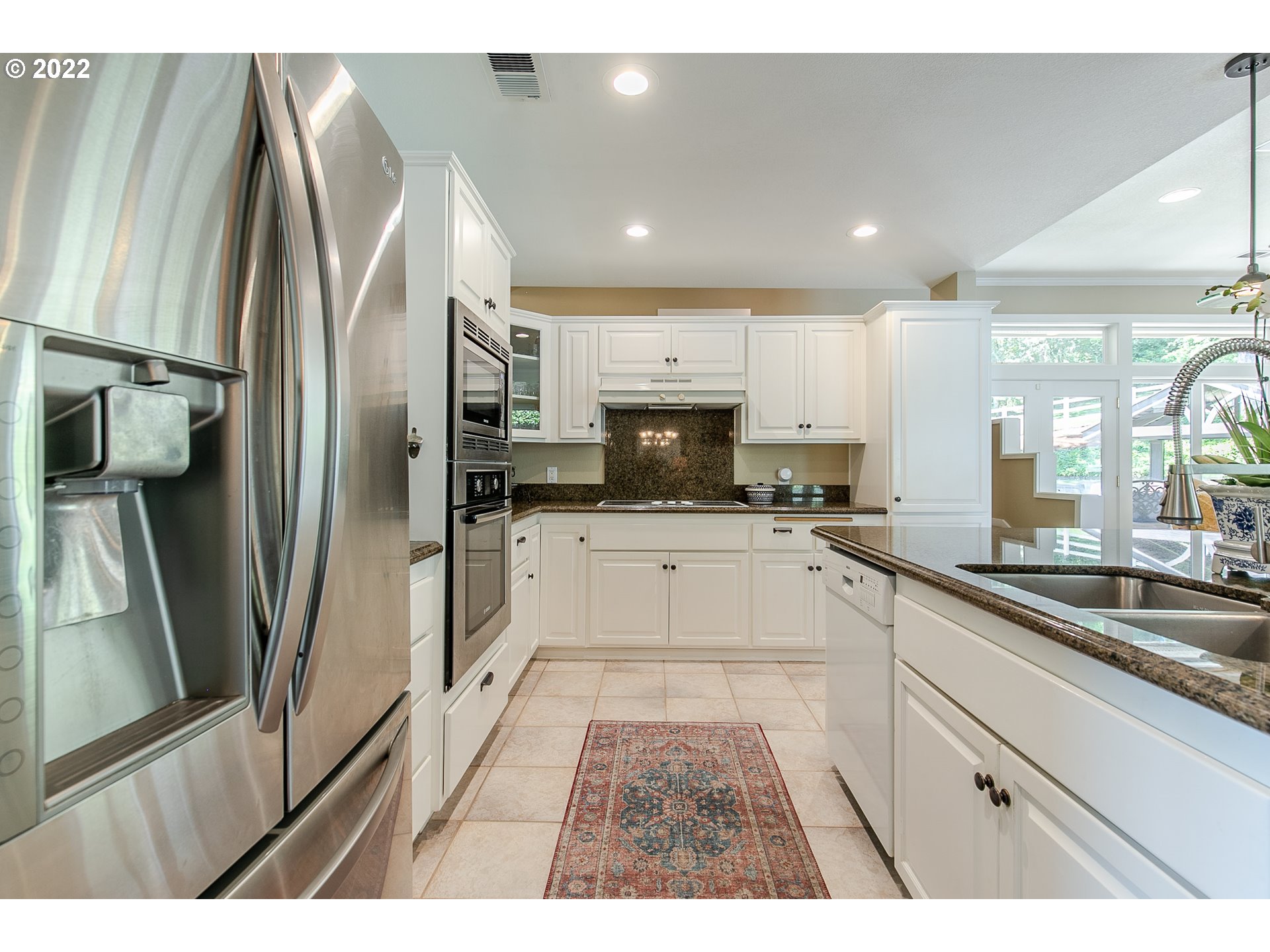 33315 Bloomberg Road Eugene, OR 97405 - Photo 14 of 32 a large kitchen with stainless steel appliances kitchen island a large counter top and a refrigerator