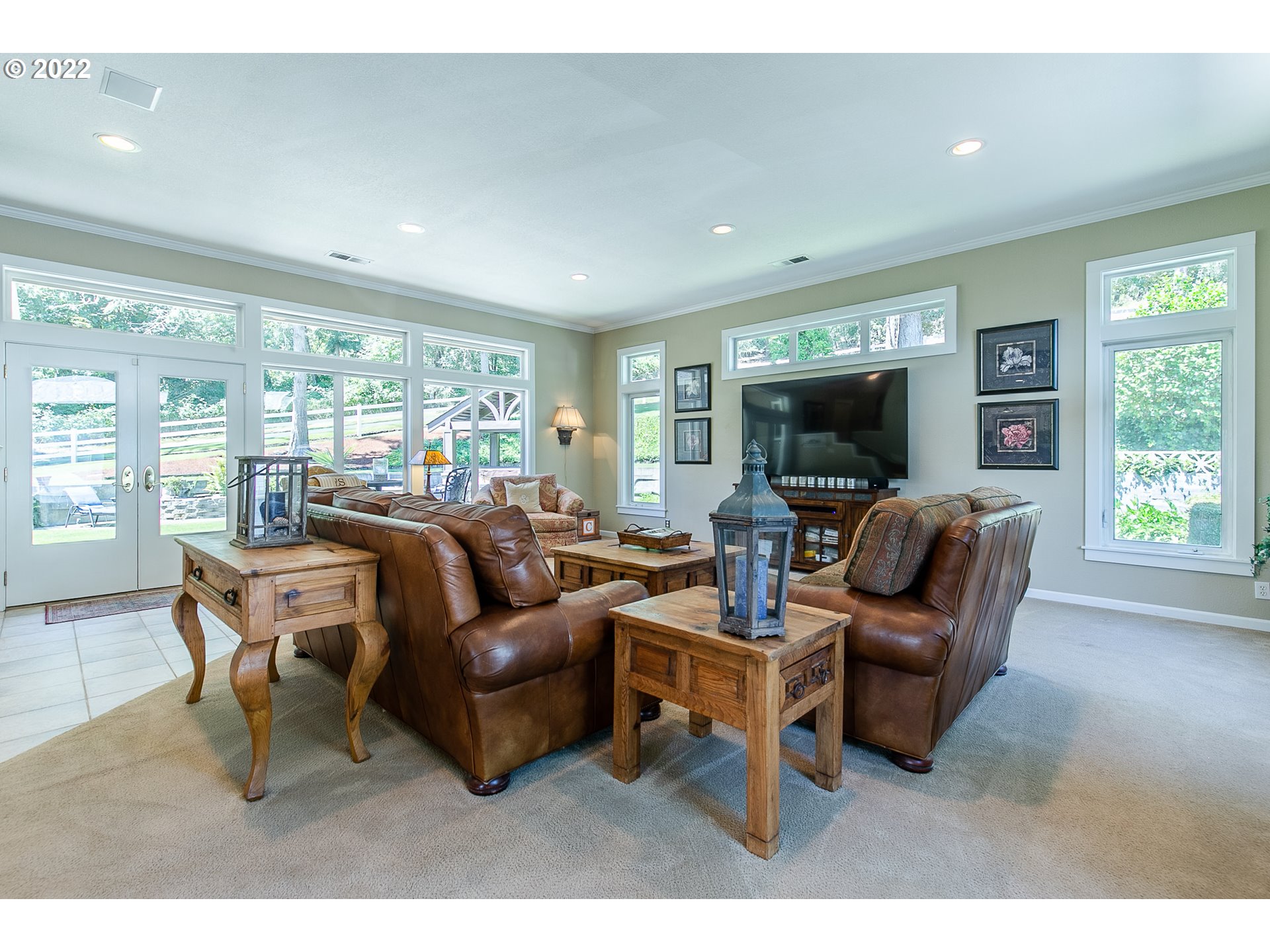 33315 Bloomberg Road Eugene, OR 97405 - Photo 16 of 32 a living room with furniture a flat screen tv and large window