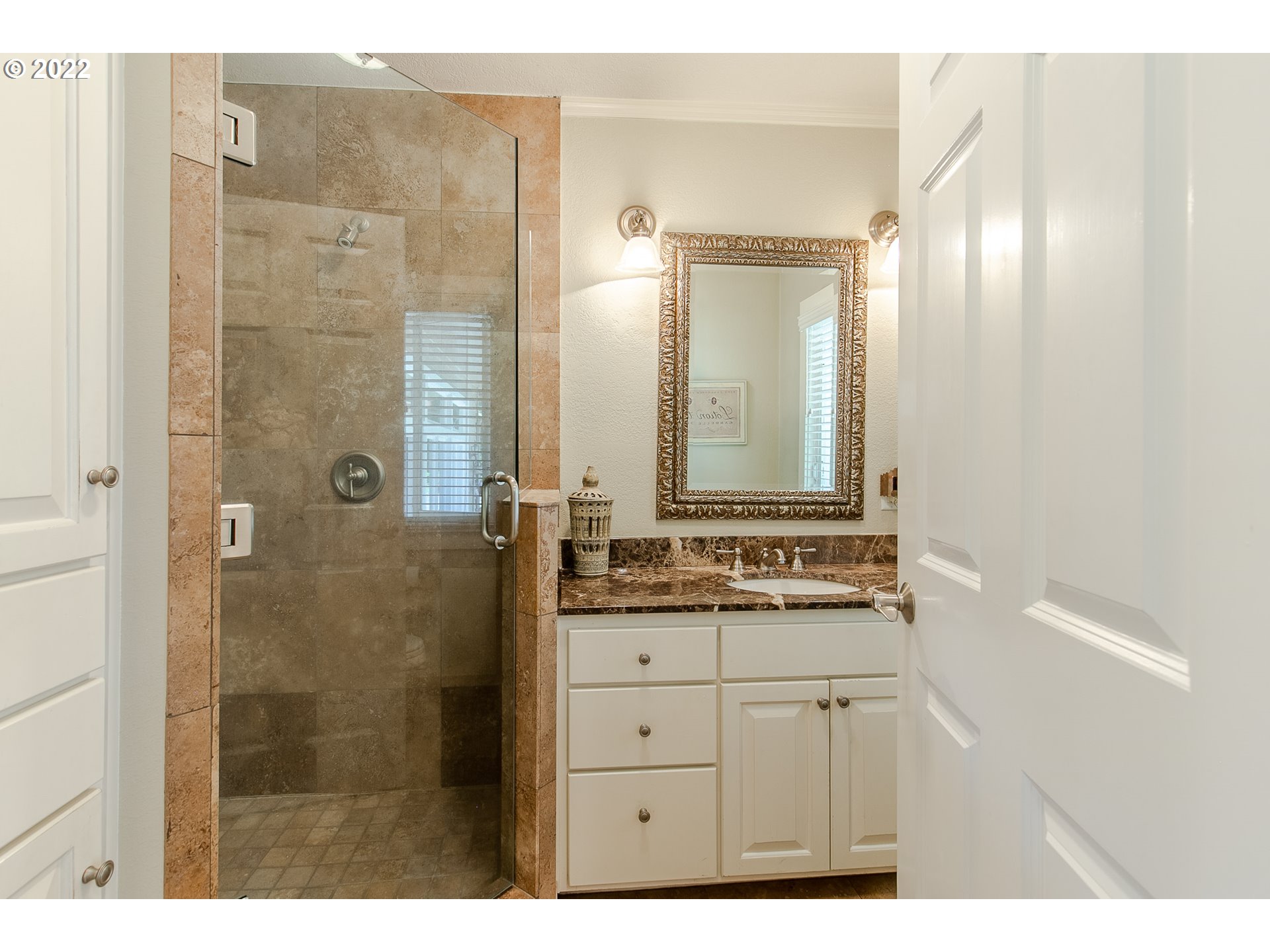 33315 Bloomberg Road Eugene, OR 97405 - Photo 19 of 32 a bathroom with a granite countertop sink a mirror and a shower