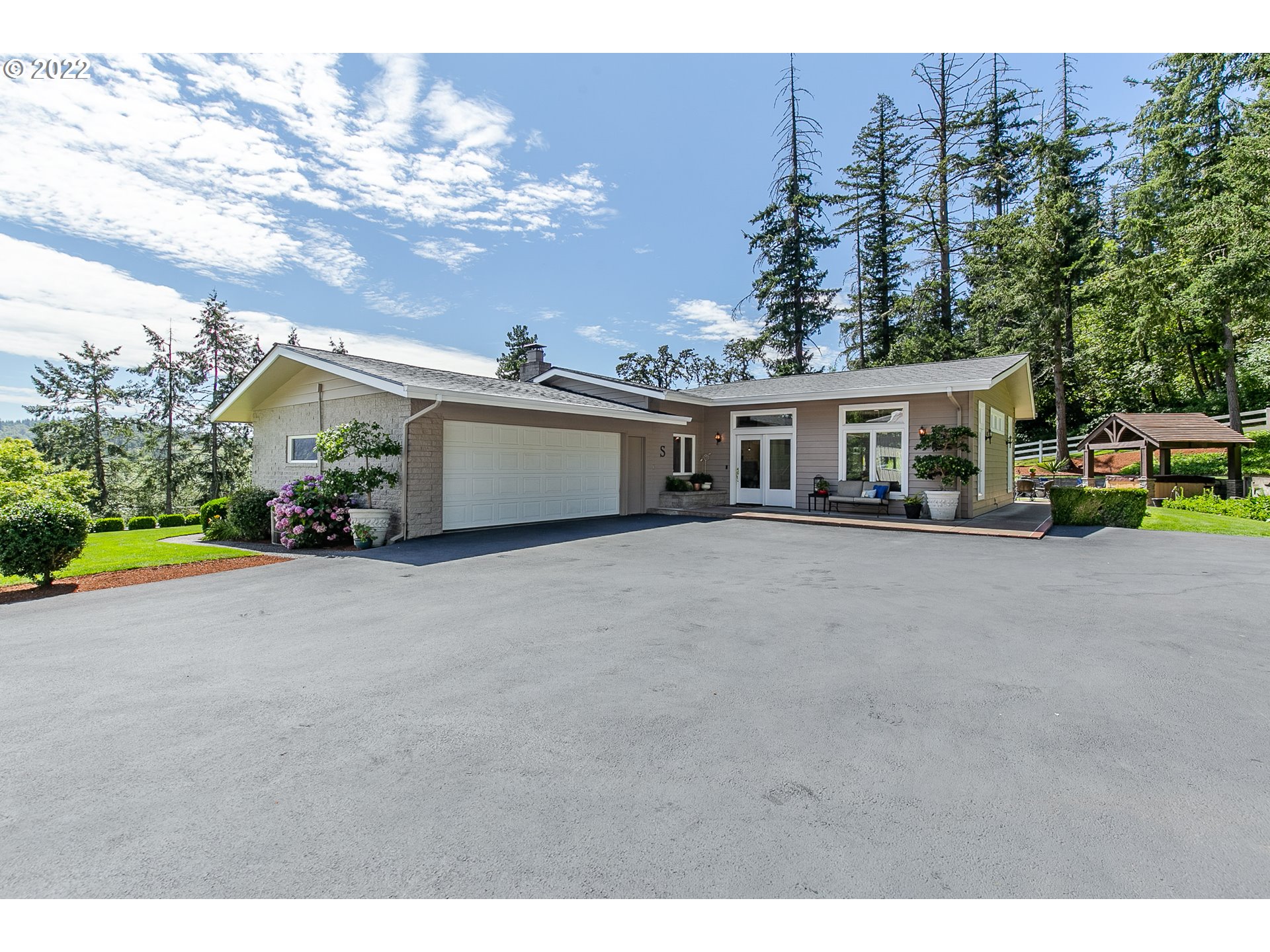 33315 Bloomberg Road Eugene, OR 97405 - Photo 28 of 32 a view of a house with a garden and pathway