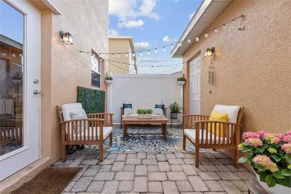 a balcony with furniture and flowers