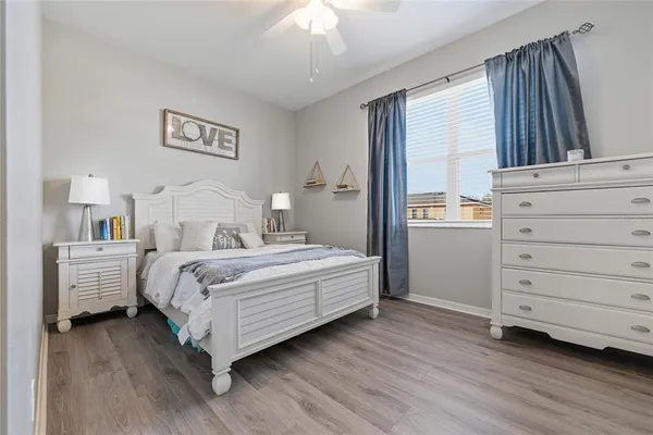 a bedroom with a bed and a dresser