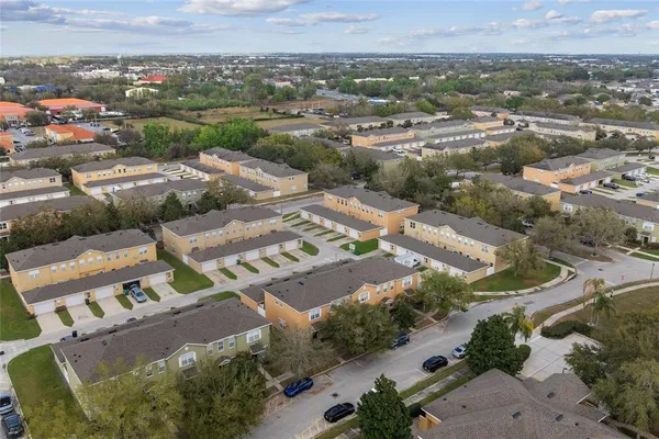 an aerial view of residential houses with outdoor space
