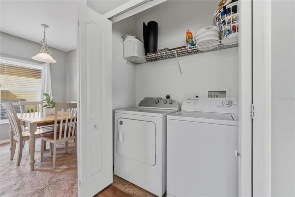 a view of storage and utility room with washer and dryer