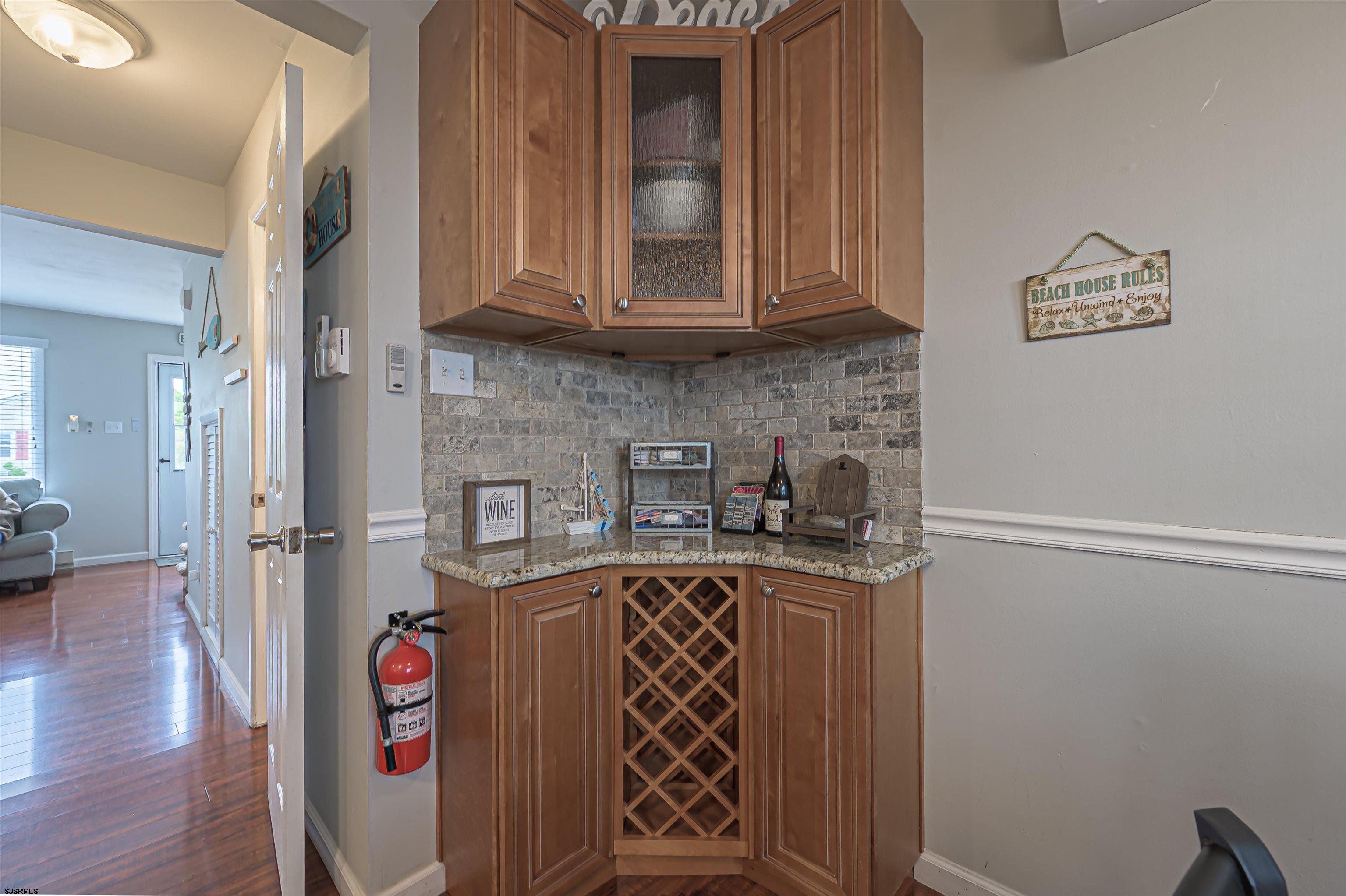 138 44th Street South, Unit D Brigantine, NJ 08203 - Photo 11 of 25 a kitchen with stainless steel appliances granite countertop a refrigerator and a stove top oven